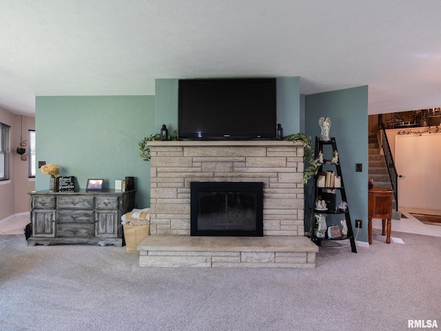 2010 E Paris Ave, Peoria, IL 61614 - carpeted living room featuring a fireplace and stairway