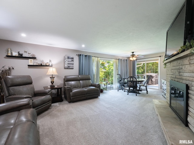 2010 E Paris Ave, Peoria, IL 61614 - living area with carpet, a ceiling fan, and a fireplace