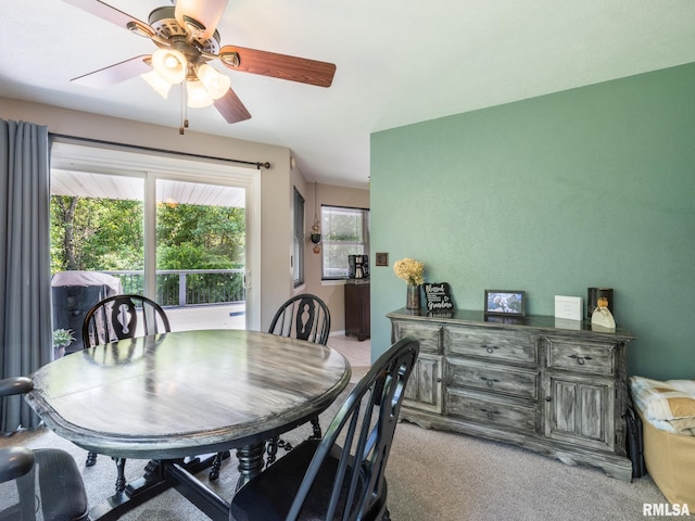 2010 E Paris Ave, Peoria, IL 61614 - dining area with a ceiling fan and light colored carpet