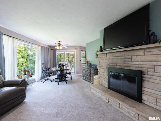 2010 E Paris Ave, Peoria, IL 61614 - living area featuring carpet, a fireplace, and ceiling fan