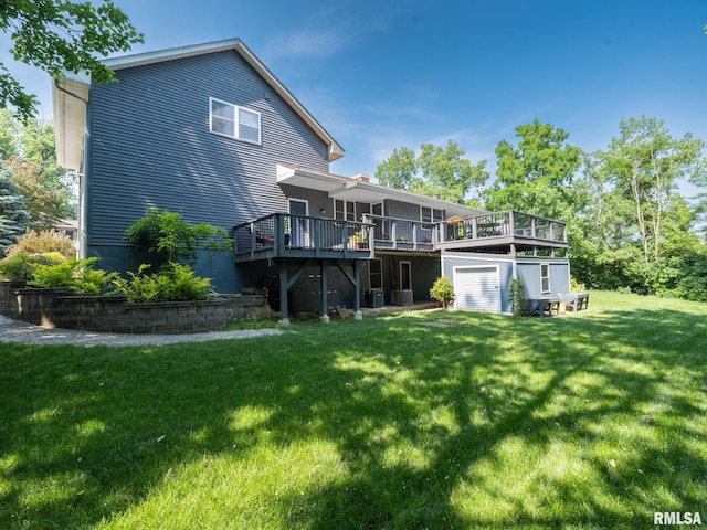 2010 E Paris Ave, Peoria, IL 61614 - back of house featuring a wooden deck, a lawn, and a chimney