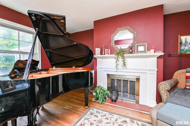 4126 N Chelsea Pl, Peoria, IL 61614 - sitting room featuring a brick fireplace and wood finished floors