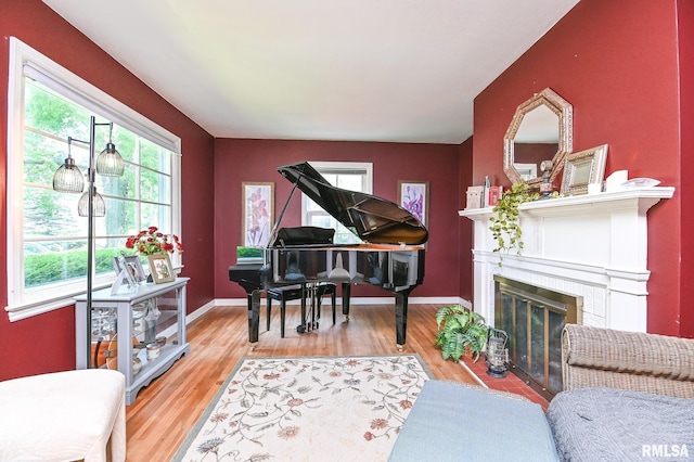 4126 N Chelsea Pl, Peoria, IL 61614 - sitting room with wood finished floors and a fireplace with flush hearth