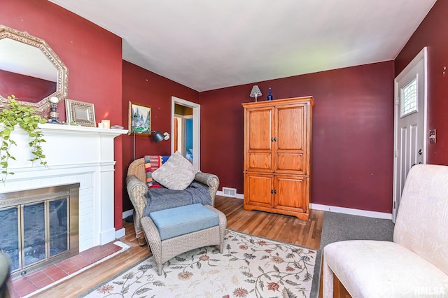 4126 N Chelsea Pl, Peoria, IL 61614 - living area with wood finished floors and a fireplace