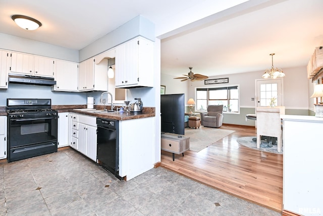 4126 N Chelsea Pl, Peoria, IL 61614 - kitchen with black appliances, under cabinet range hood, dark countertops, a ceiling fan, and white cabinets