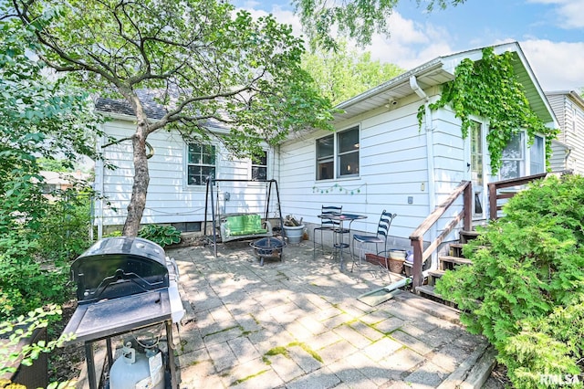 4126 N Chelsea Pl, Peoria, IL 61614 - view of patio with an outdoor fire pit and a grill