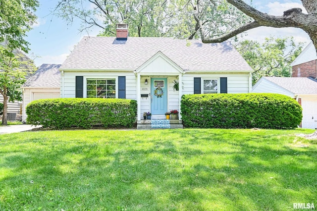 4126 N Chelsea Pl, Peoria, IL 61614 - view of front of house featuring a chimney, a front lawn, and roof with shingles