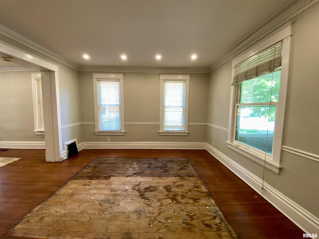 1502 W Columbia Ter, Peoria, IL 61606 - empty room featuring wood finished floors, ornamental molding, baseboards, and recessed lighting
