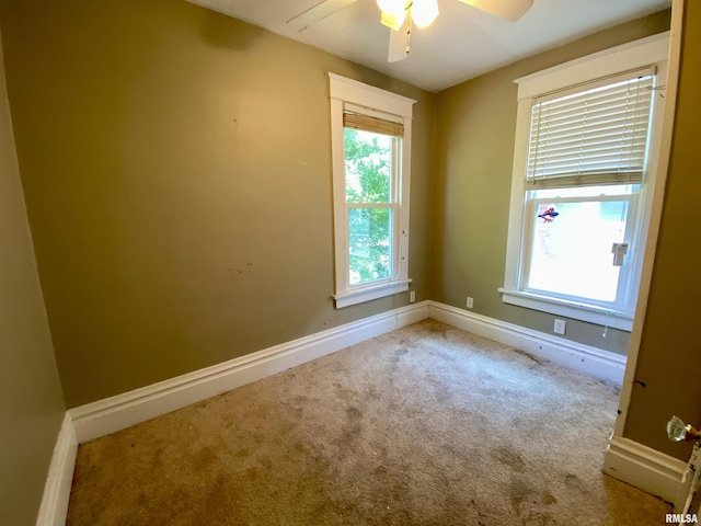 1502 W Columbia Ter, Peoria, IL 61606 - unfurnished room with a ceiling fan, carpet flooring, and baseboards