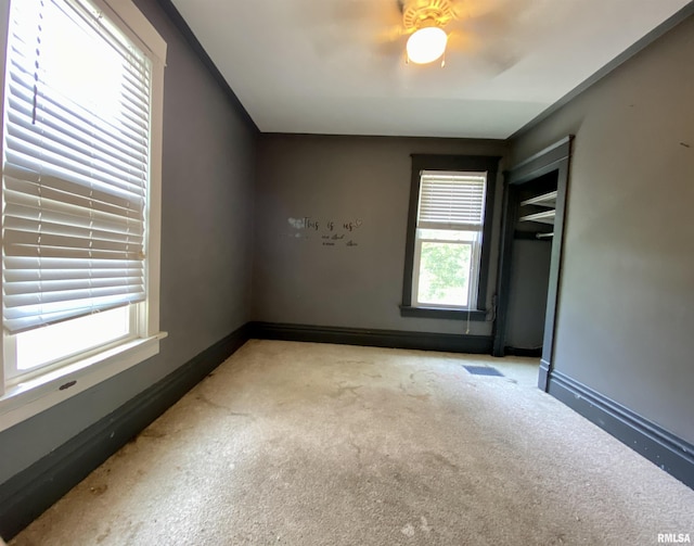 1502 W Columbia Ter, Peoria, IL 61606 - carpeted empty room featuring baseboards