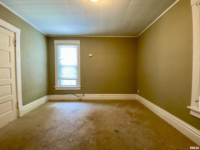 1502 W Columbia Ter, Peoria, IL 61606 - carpeted spare room with ornamental molding and baseboards