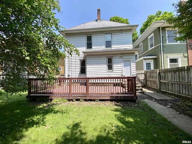 1502 W Columbia Ter, Peoria, IL 61606 - rear view of house featuring a wooden deck, a chimney, and roof with shingles