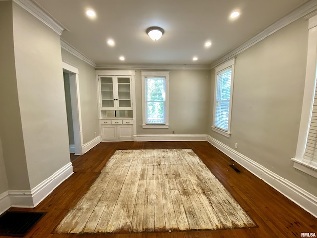 1502 W Columbia Ter, Peoria, IL 61606 - spare room featuring crown molding, dark wood-style flooring, baseboards, and recessed lighting