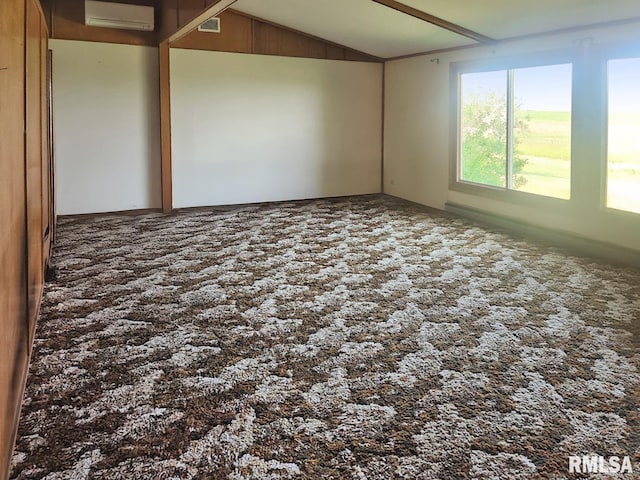 18223 N Slane Rd, Princeville, IL 61559 - unfurnished room featuring a wall unit AC and lofted ceiling