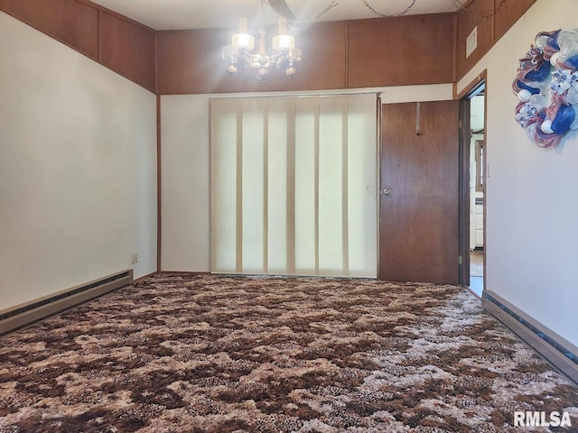 18223 N Slane Rd, Princeville, IL 61559 - spare room featuring baseboard heating and a chandelier