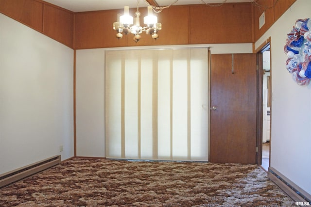 18223 N Slane Rd, Princeville, IL 61559 - empty room with a baseboard radiator and a chandelier