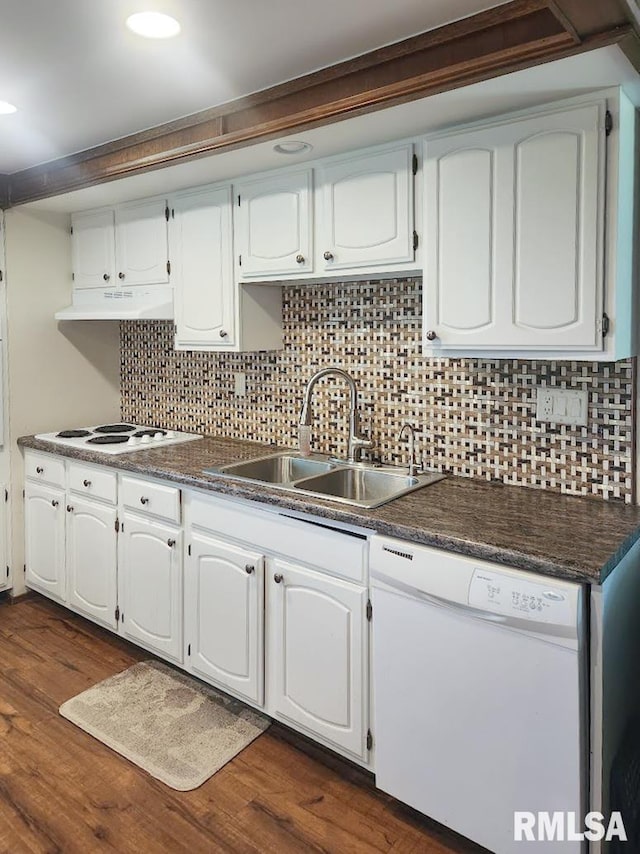 18223 N Slane Rd, Princeville, IL 61559 - kitchen with white appliances, under cabinet range hood, dark countertops, tasteful backsplash, and recessed lighting