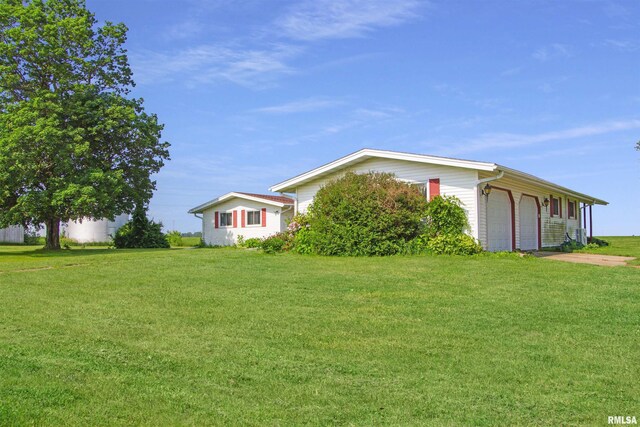 18223 N Slane Rd, Princeville, IL 61559 - view of home's exterior featuring a lawn