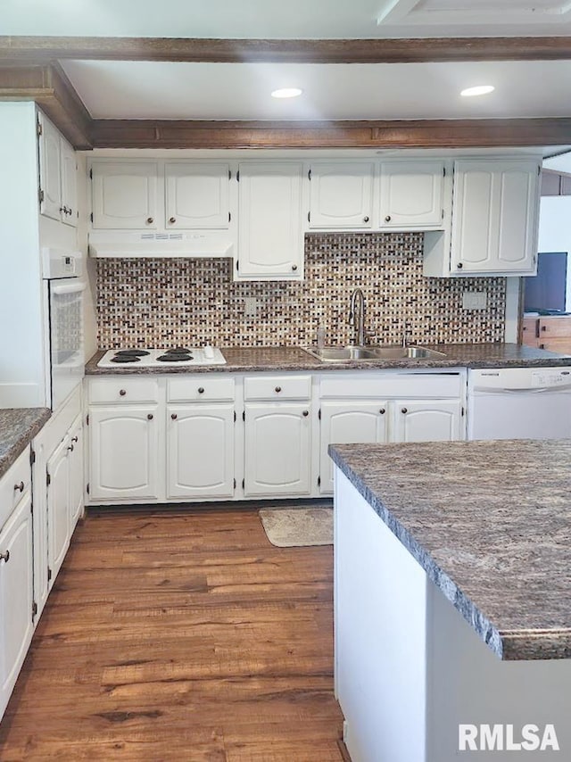 18223 N Slane Rd, Princeville, IL 61559 - kitchen with white appliances, dark countertops, decorative backsplash, white cabinetry, and dark wood finished floors