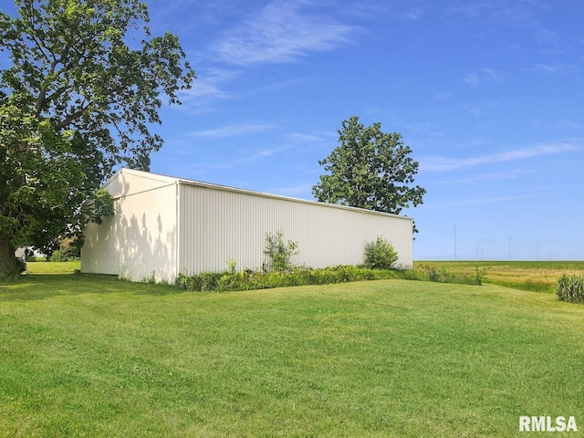 18223 N Slane Rd, Princeville, IL 61559 - view of green lawn featuring a pole building and an outbuilding