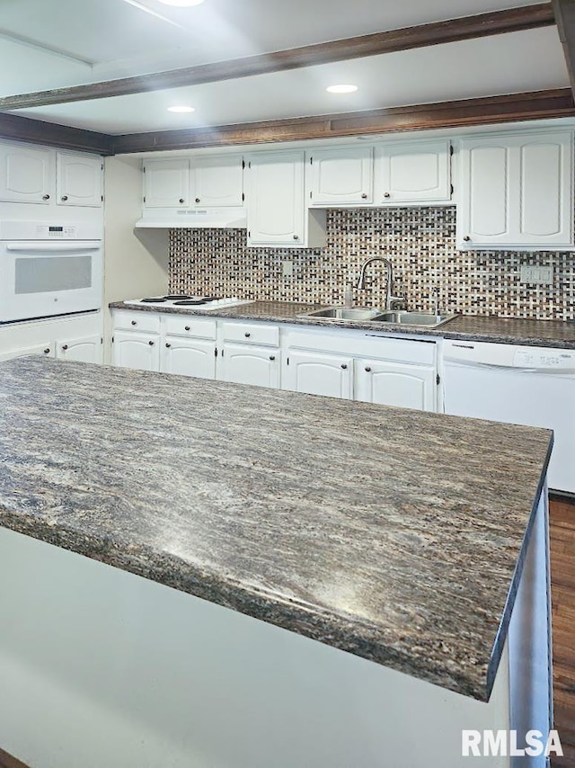 18223 N Slane Rd, Princeville, IL 61559 - kitchen with white appliances, under cabinet range hood, dark wood finished floors, white cabinetry, and recessed lighting