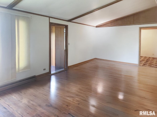 18223 N Slane Rd, Princeville, IL 61559 - unfurnished room featuring wood finished floors and vaulted ceiling