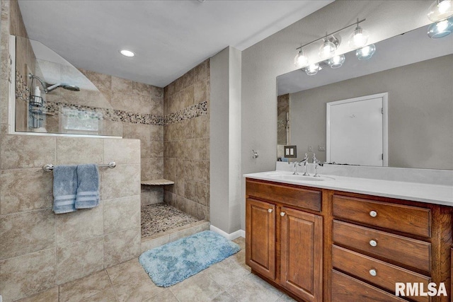 486 E High Point Dr, Peoria, IL 61614 - bathroom with a walk in shower, vanity, tile patterned floors, and baseboards