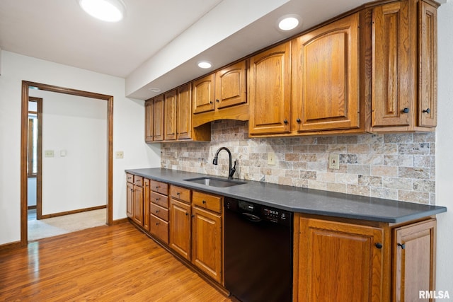 905 Highland Ct, Germantown Hills, IL 61548 - kitchen with black dishwasher, a sink, dark countertops, light wood finished floors, and recessed lighting