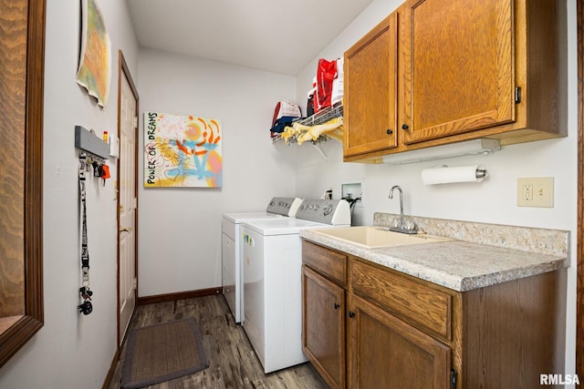 905 Highland Ct, Germantown Hills, IL 61548 - laundry area featuring separate washer and dryer, cabinet space, wood finished floors, and baseboards