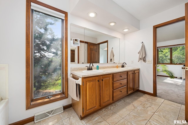 905 Highland Ct, Germantown Hills, IL 61548 - bathroom featuring baseboards, double vanity, and recessed lighting
