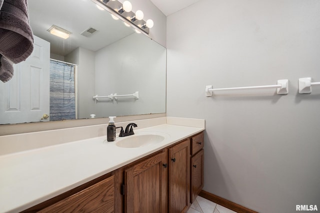 905 Highland Ct, Germantown Hills, IL 61548 - bathroom featuring vanity, baseboards, and tile patterned flooring