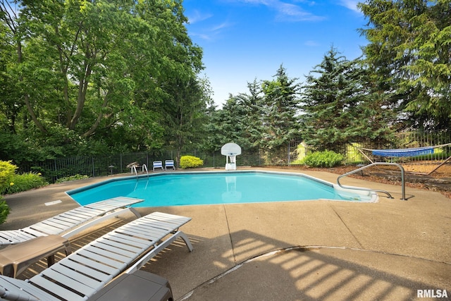 905 Highland Ct, Germantown Hills, IL 61548 - view of swimming pool featuring a patio, a fenced backyard, and view of scattered trees