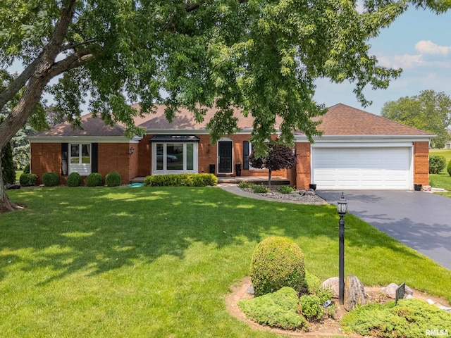 22 Cypress Pt, Pekin, IL 61554 - ranch-style house featuring driveway, a garage, a front yard, brick siding, and roof with shingles