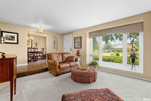 22 Cypress Pt, Pekin, IL 61554 - living area with a chandelier, carpet flooring, and baseboards