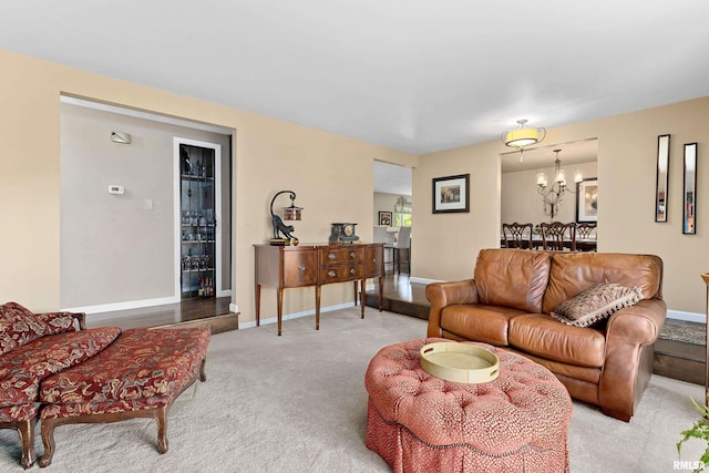 22 Cypress Pt, Pekin, IL 61554 - living area with light colored carpet, a chandelier, and baseboards