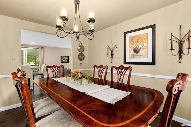 22 Cypress Pt, Pekin, IL 61554 - dining area featuring a chandelier, wood finished floors, and baseboards