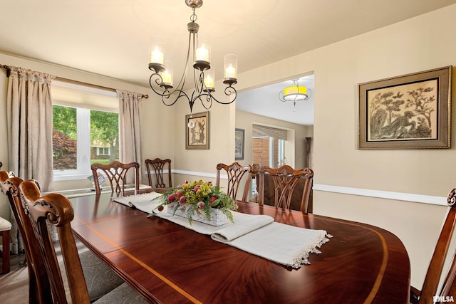 22 Cypress Pt, Pekin, IL 61554 - dining room featuring healthy amount of natural light and a chandelier