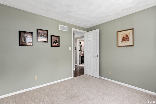 22 Cypress Pt, Pekin, IL 61554 - unfurnished bedroom featuring carpet flooring and baseboards