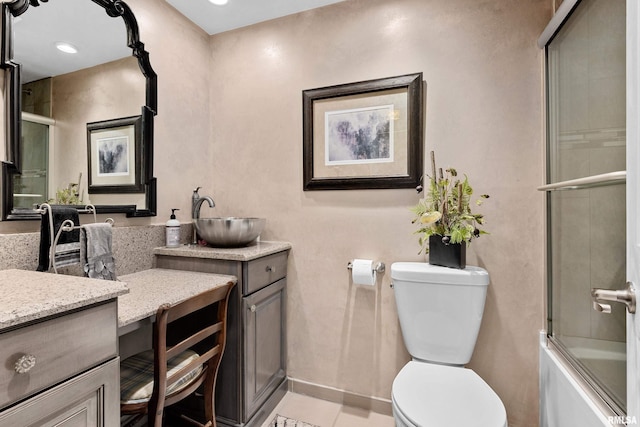 22 Cypress Pt, Pekin, IL 61554 - bathroom featuring vanity, toilet, bath / shower combo with glass door, and baseboards
