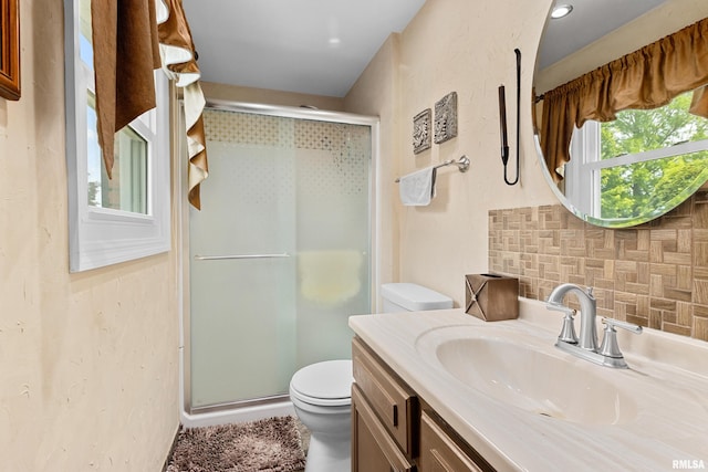 22 Cypress Pt, Pekin, IL 61554 - full bathroom with toilet, a shower stall, vanity, and backsplash