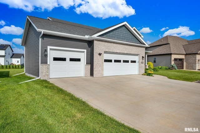 11306 N Joseph St, Dunlap, IL 61525 - view of front of home with driveway, brick siding, a front yard, and an attached garage