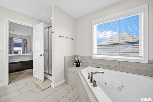 11306 N Joseph St, Dunlap, IL 61525 - full bath with a shower stall, a jetted tub, baseboards, and vanity