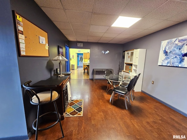 113 N Kickapoo St, Lincoln, IL 62656 - dining space with a paneled ceiling and wood finished floors