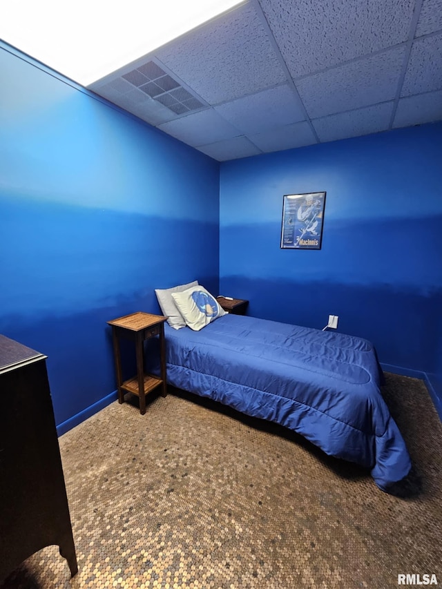 113 N Kickapoo St, Lincoln, IL 62656 - bedroom with carpet flooring, a paneled ceiling, and baseboards