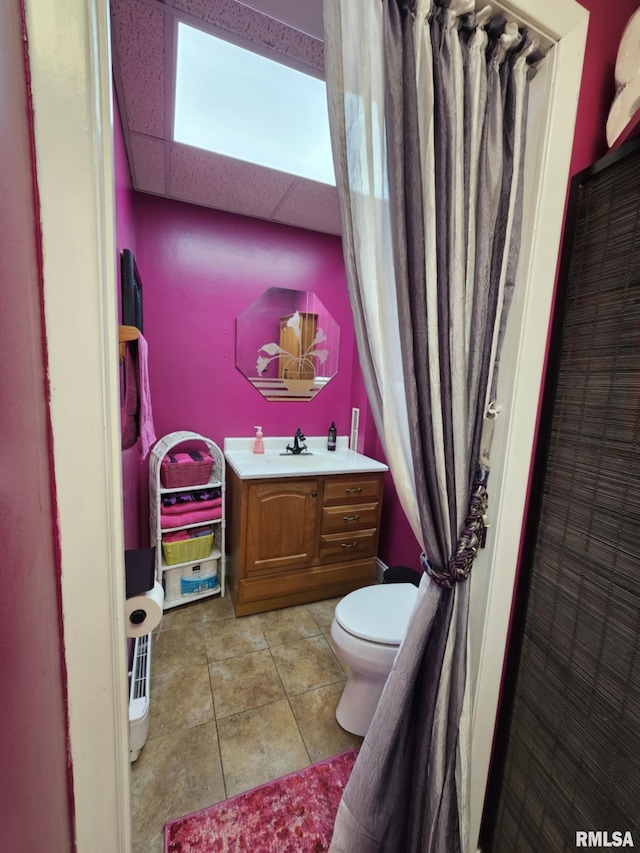 113 N Kickapoo St, Lincoln, IL 62656 - bathroom featuring toilet, vanity, and tile patterned flooring