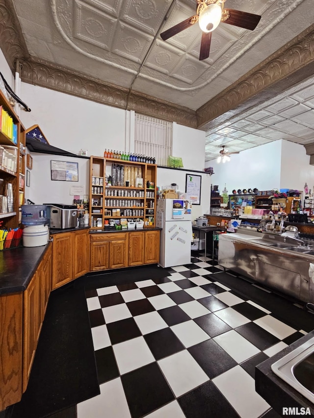 113 N Kickapoo St, Lincoln, IL 62656 - kitchen with a ceiling fan, open shelves, dark floors, an ornate ceiling, and brown cabinetry