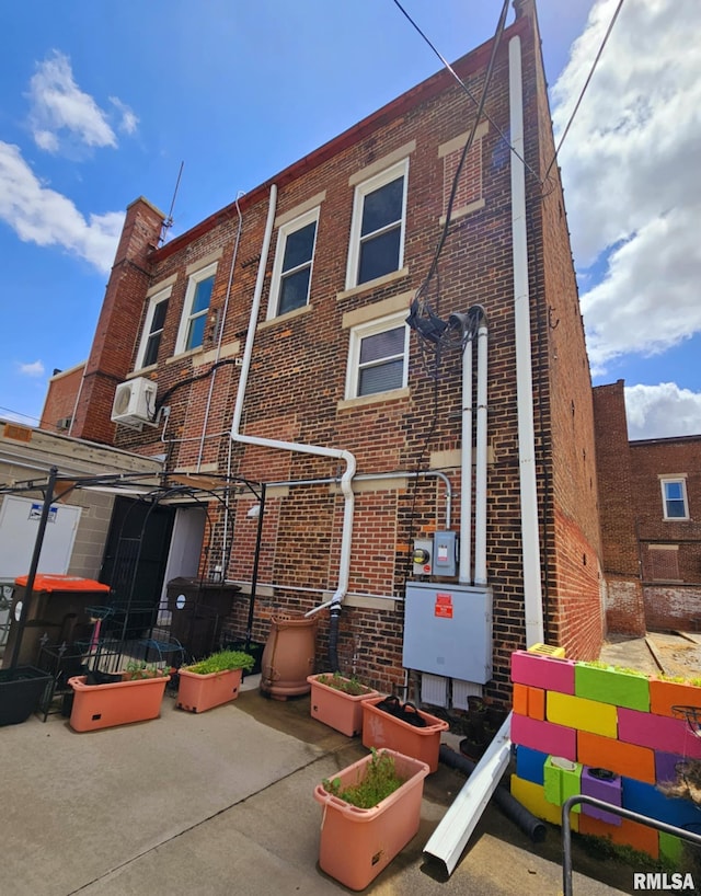113 N Kickapoo St, Lincoln, IL 62656 - back of property with brick siding