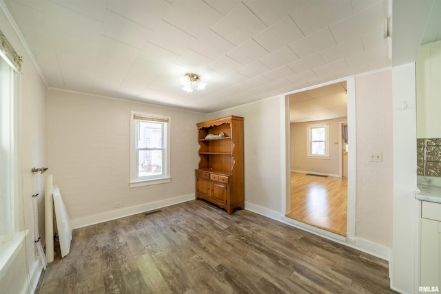 116 S 8th Ave, Canton, IL 61520 - empty room featuring crown molding, wood finished floors, and baseboards