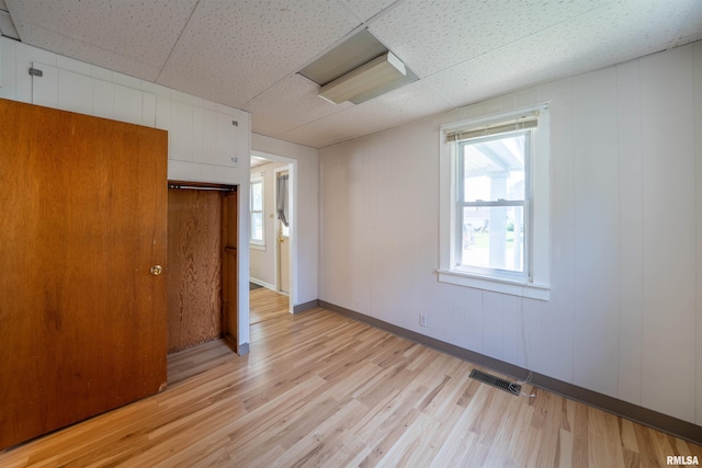116 S 8th Ave, Canton, IL 61520 - unfurnished bedroom with light wood-type flooring and baseboards