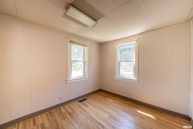 116 S 8th Ave, Canton, IL 61520 - spare room featuring light wood-style flooring and baseboards